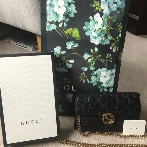 Gucci Handbags - Gucci black crossbody. Gold chain.